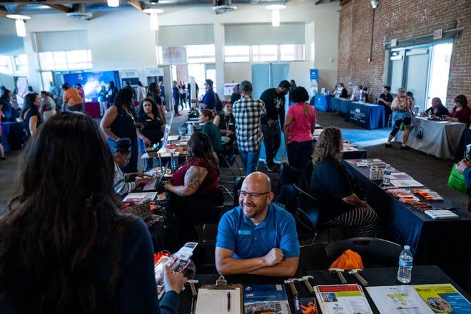 Adrian Angeles, program coordinator at Habitat Humanity Central Arizona, attends a record sealing and expungement clinic and resource fair sponsored by Utah-based tech company Rasa Legal in the A.E. England building at Arizona State University in Phoenix, Ariz., on Dec. 6, 2023.