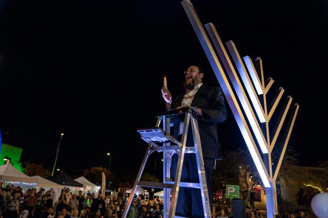 Rabbi Laibel Blotner leads a menorah lighting ceremony in Mesa on Dec. 7, 2023.