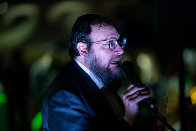 Rabbi Laibel Blotner leads a menorah lighting ceremony in Mesa on Dec. 7, 2023.