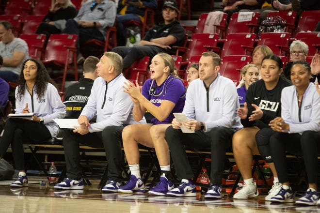 Grand Canyon University sidelines cheer for their teammates at Desert Financial Arena on Dec. 8, 2023.