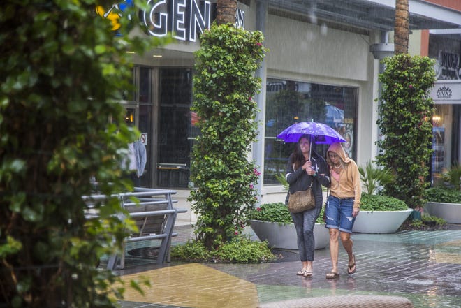 Adelaide Burkett (left) and her mother Adelaide D'Ippolito make their way after pedicures at Tempe Marketplace in 2018.