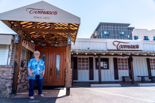 Patricia Maggiore, founder of Tomaso’s, poses for a portrait outside the restaurant in Phoenix on May 6, 2023.